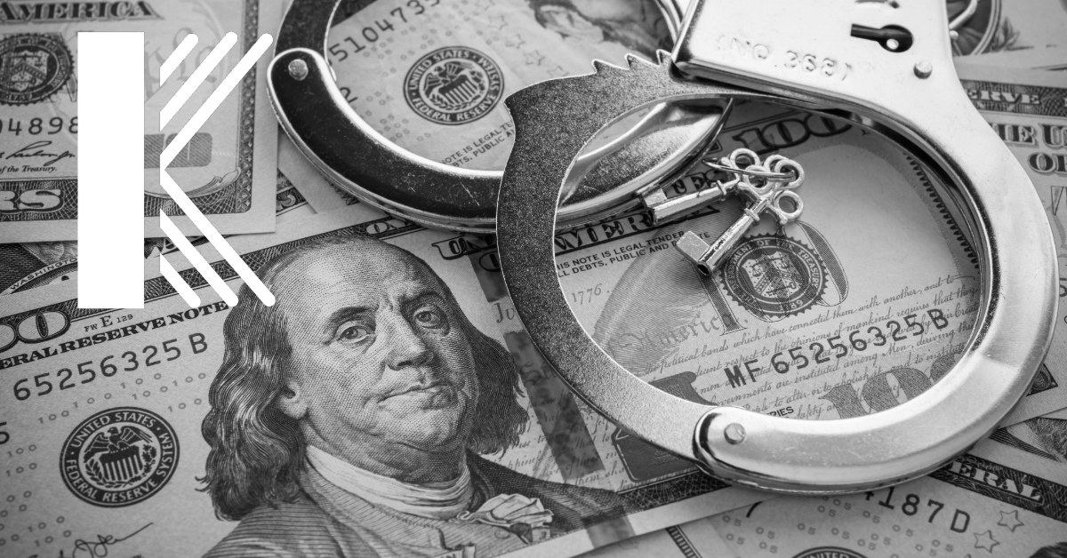 cash with handcuffs on top indicating financial crime