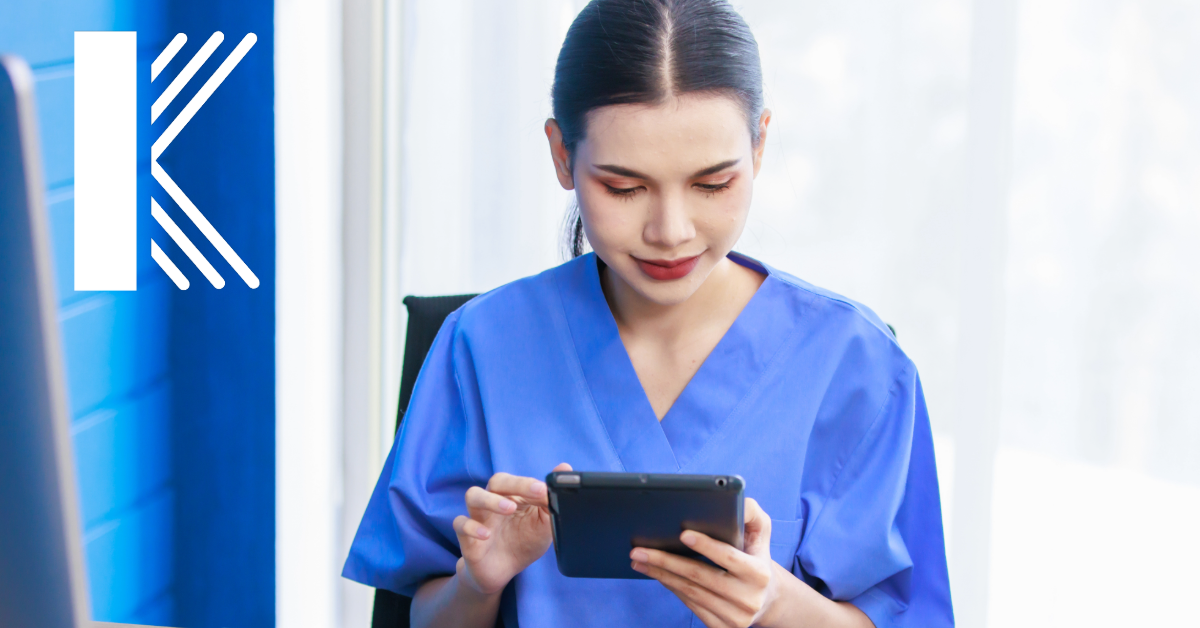 A chiropractor in blue scrubs looks down at a tablet while working in a brightly lit office. The Kastner Insurance logo is visible on the left side of the image.