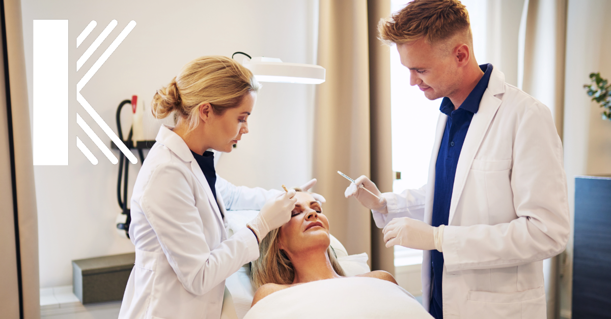 Two dermatology employees assisting a patient in a dermatology office in Baton Rouge Louisiana