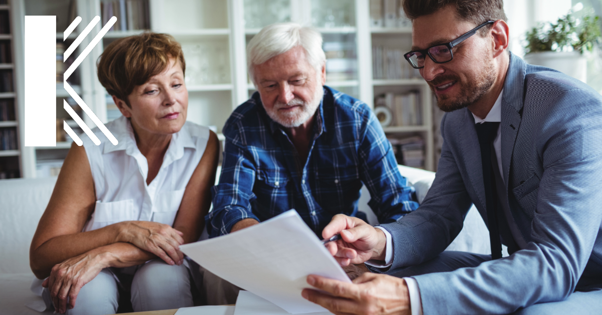 financial planner with his clients with Kastner logo displayed