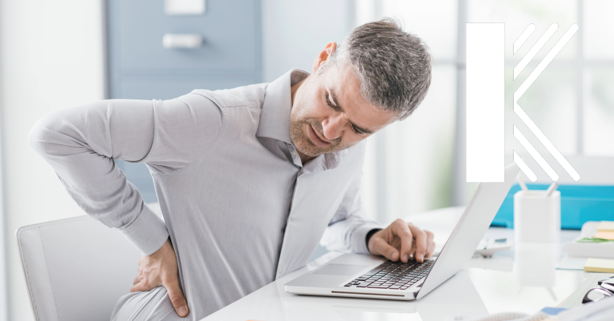 injured office worker symbolizing a workers' compensation insurance claim about to happen with Kastner Insurance logo displayed